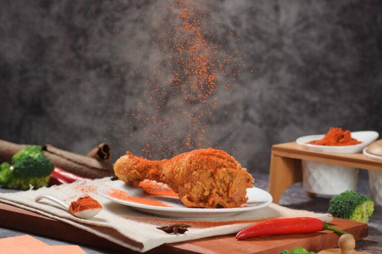 Crispy fried chicken piece on a plate, representing a KFC family meal in South Africa